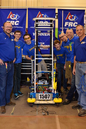 The pit crew pose with the 2015 robot