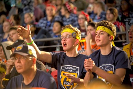 Lucas Krolczyk (left) and Bronson Slattery cheer on their team Ranger Robotics.