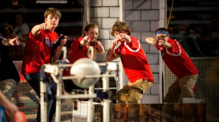 Peyton Romer, Rachel Connor, Andrew Thompson and David Tomer representing Team SPARKS from Schroeder and Thomas High School in Webster, N.Y. pose for a photo prior to the final match at the FIRST Robotics Pittsburgh Regional competition.