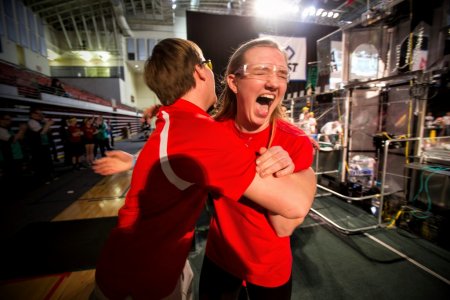 Rachel Connor from Schroeder and Thomas High schools' team from Webster, N.Y. celebrates her teams victory during the finals at the FIRST Robotics Pittsburgh Regional competition.